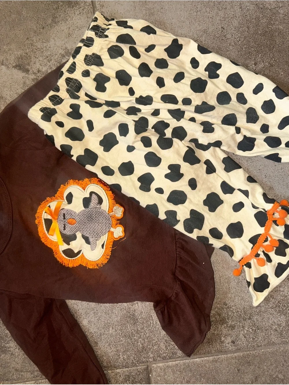 Brown Top and Black-and-Cream Cow Print Pants Set with Orange Trim