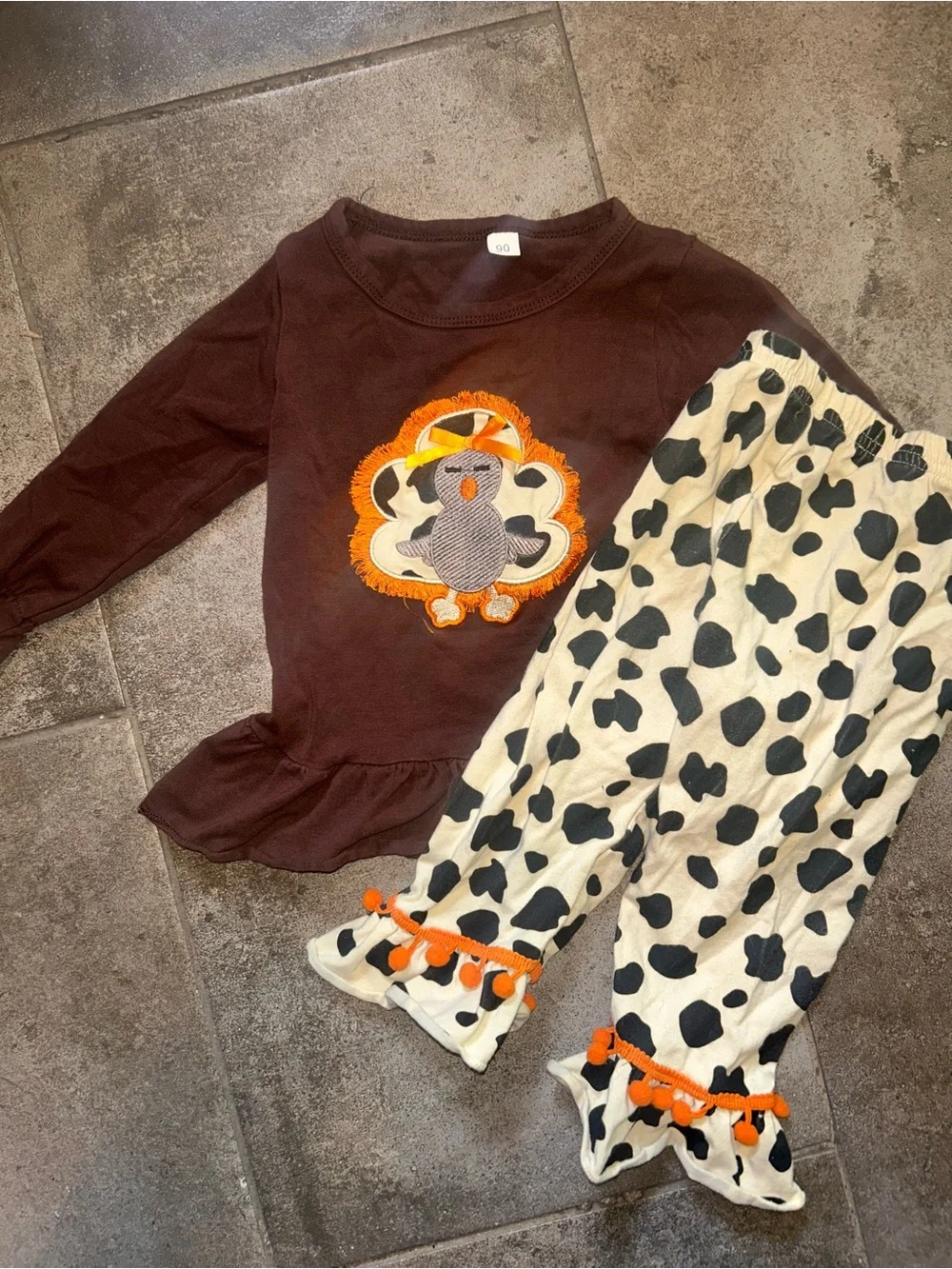 Brown Top and Black-and-Cream Cow Print Pants Set with Orange Trim