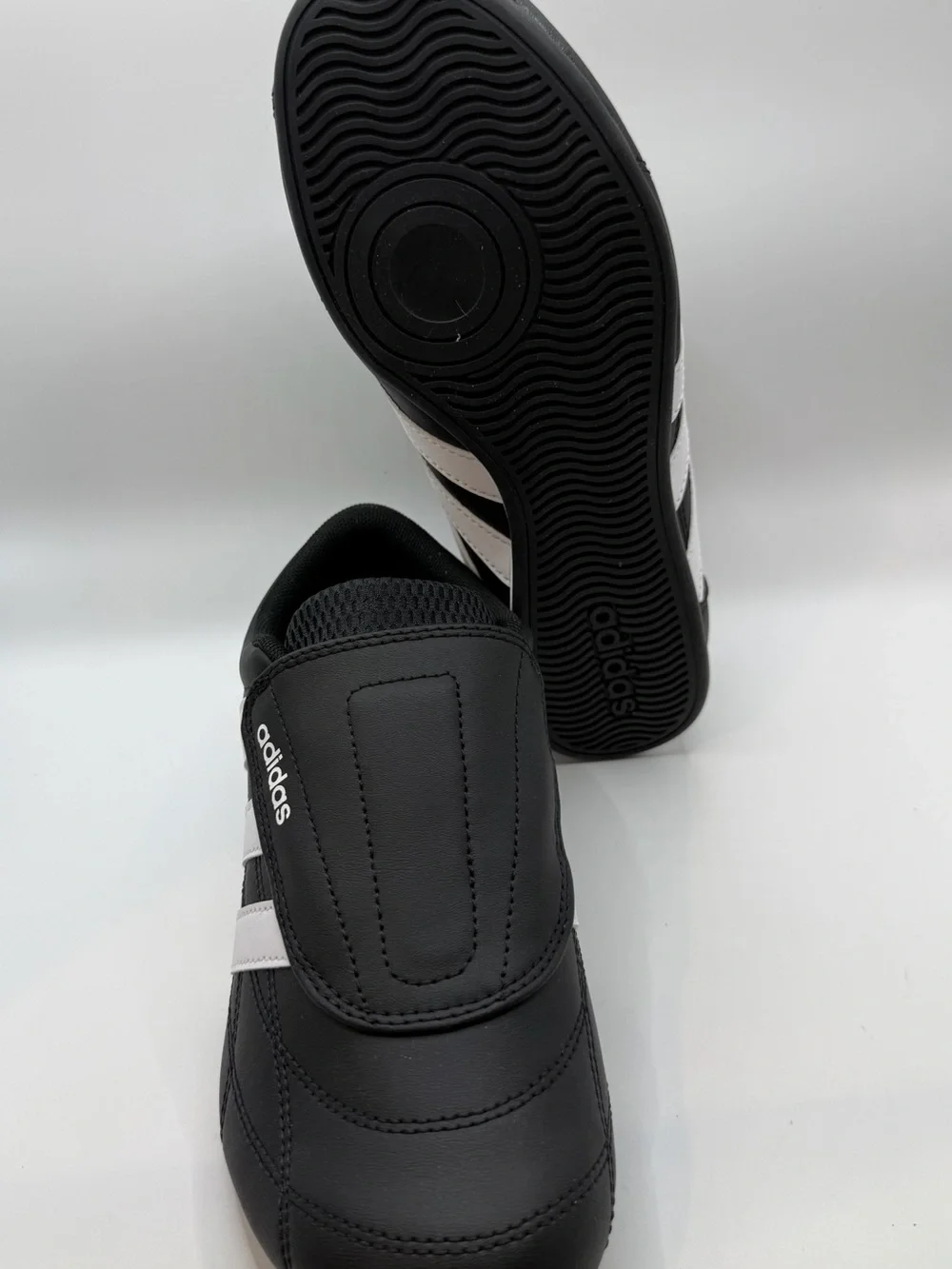 adidas Black and White Three-Stripe Slip-On Sneakers