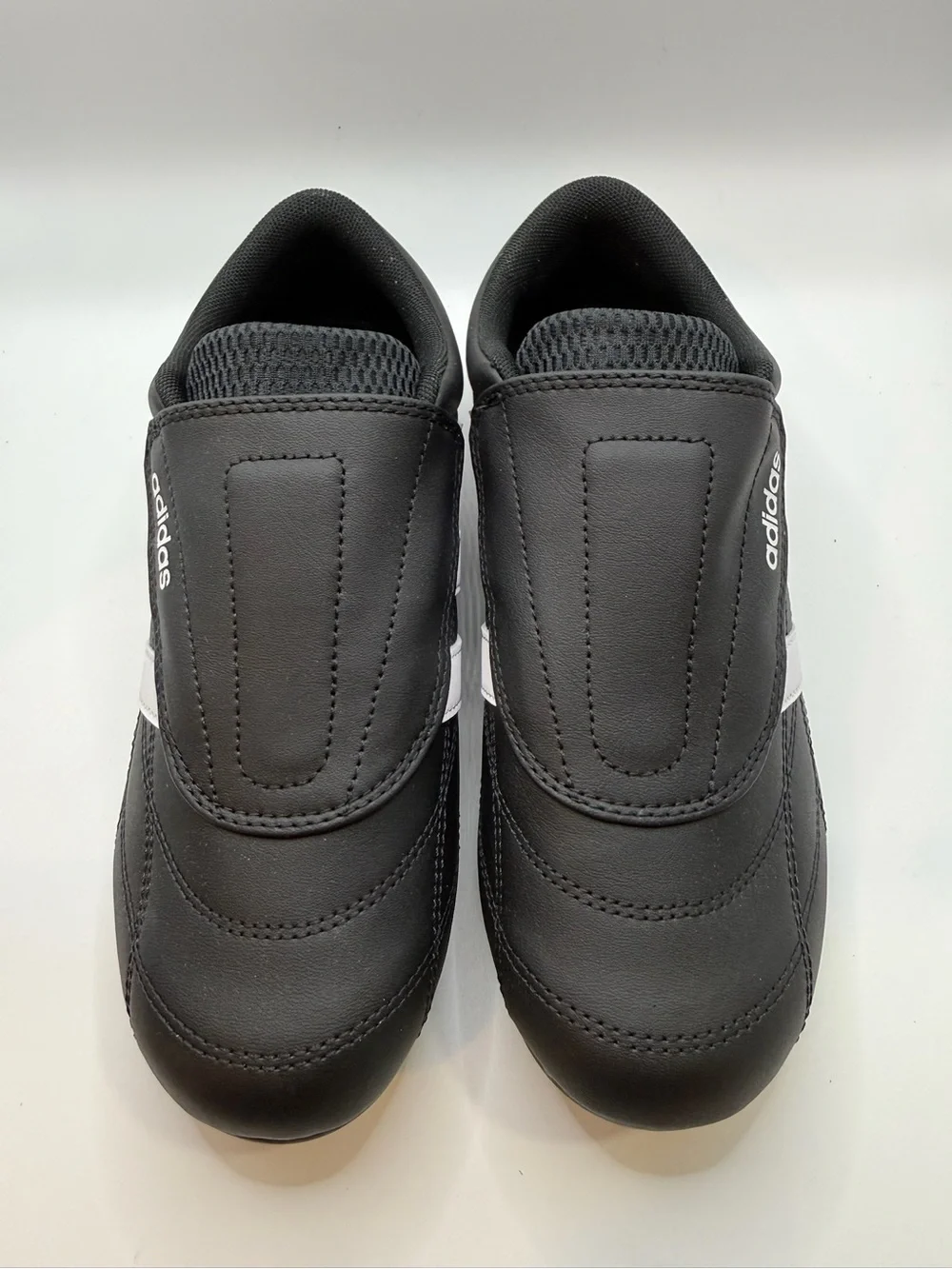 adidas Black and White Three-Stripe Slip-On Sneakers