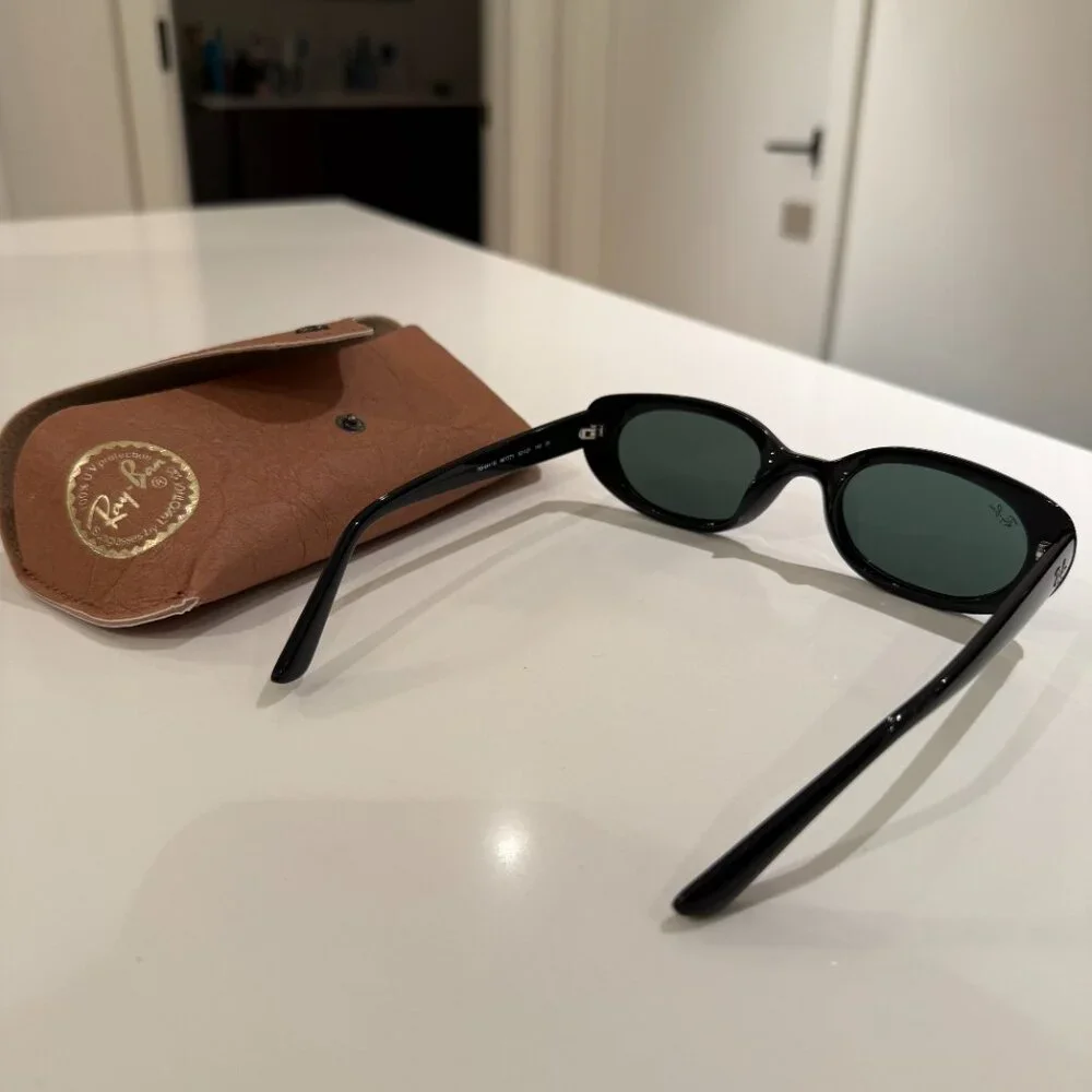 Ray-Ban Black Oval Sunglasses with Dark Green Lenses